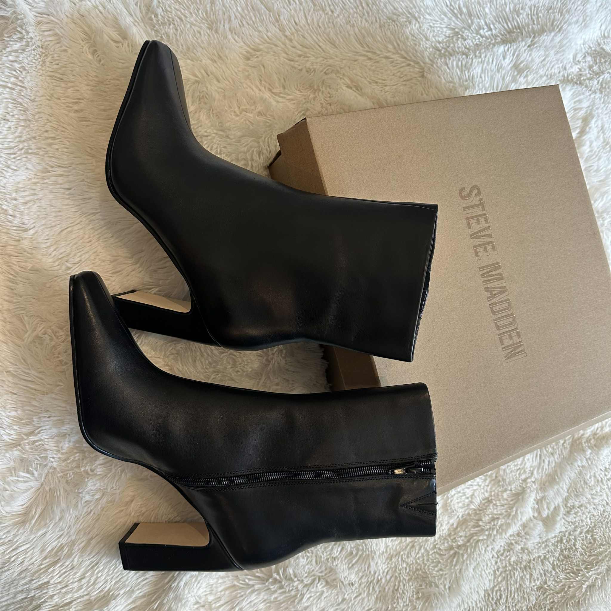 Sleek black ankle boots by Steve Madden