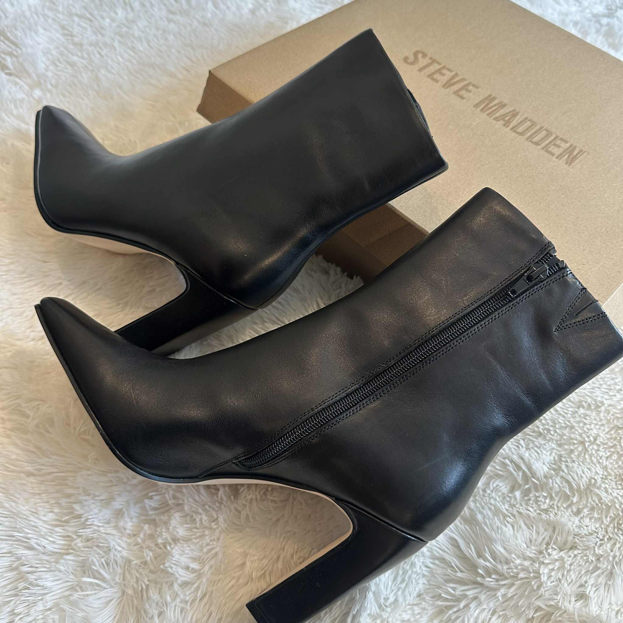 Sleek black ankle boots by Steve Madden